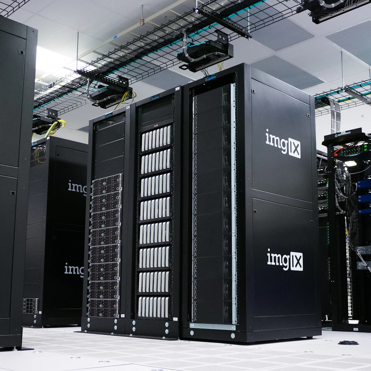 Rows of server racks and network cabling in a data center